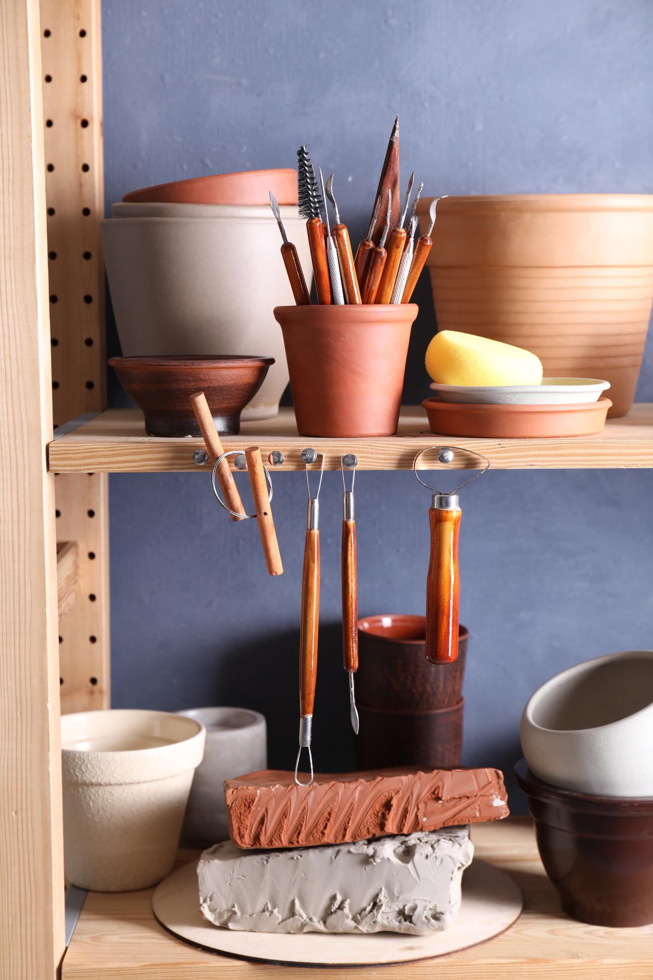 Small kitchen studio with natural light and utensils
